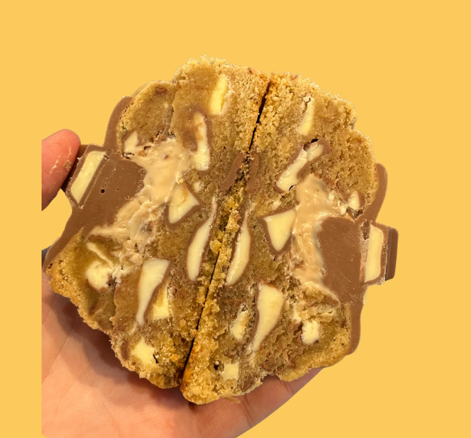 Kinder cookie cross section showing milk chocolate chunks and hazelnut spread